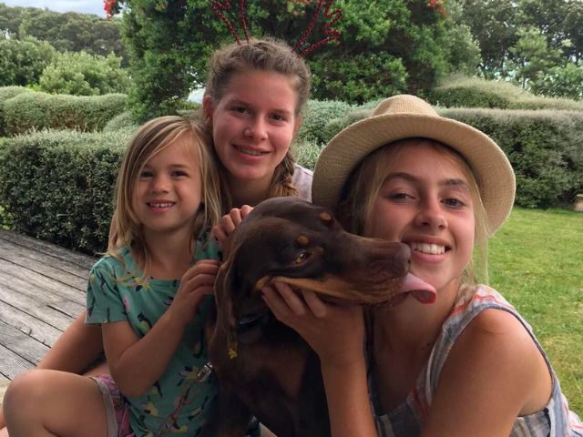 Host siblings with the family dog